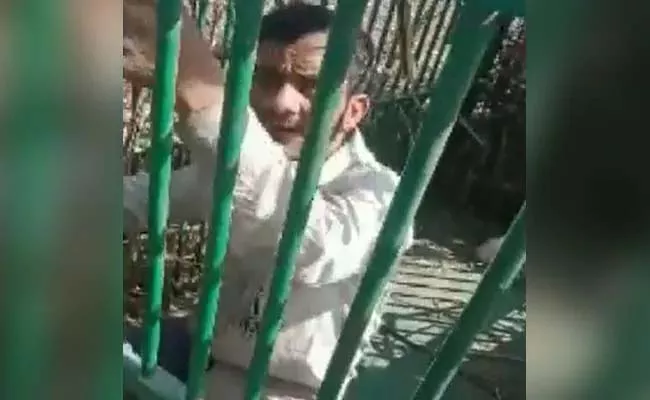 Viral Video: Man Stuck In Cage Meant For Leopard At Uttar Pradesh - Sakshi