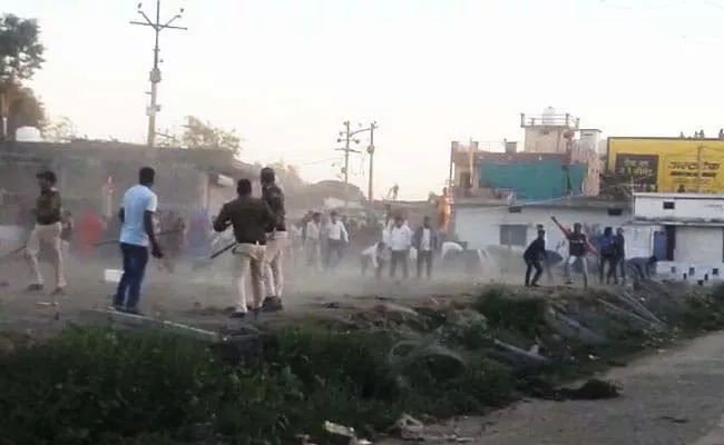 Huge Mob Attacked Police Team In Madhya Pradesh Cops Run Over  - Sakshi