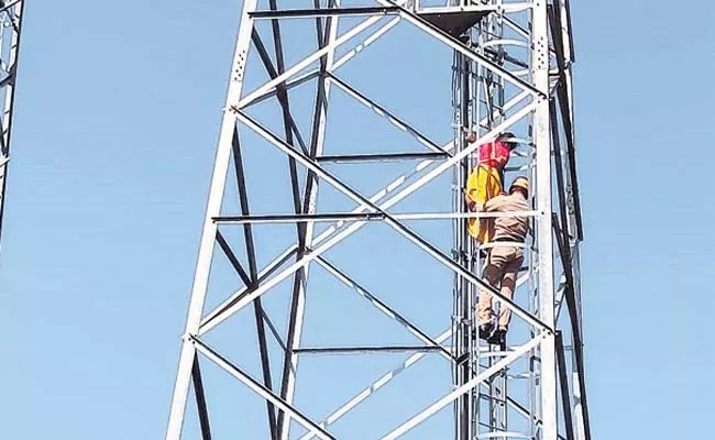 Protested By Climbing Cell Tower That Land Registered Illegally - Sakshi