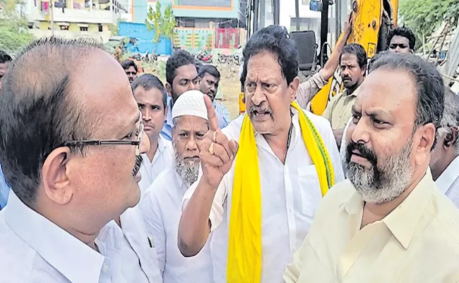 TDP leader fires on officers removing encroachments in Gudivada - Sakshi