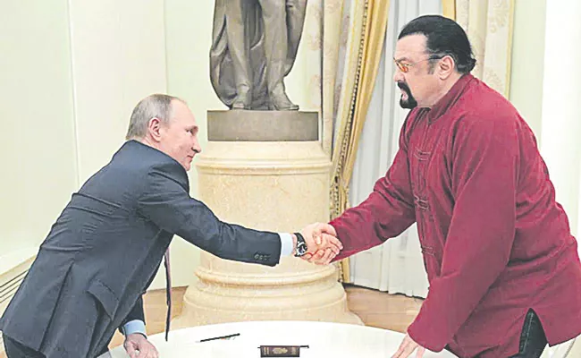 Russian president awards Order of Friendship to Hollywood actor Steven Seagal - Sakshi