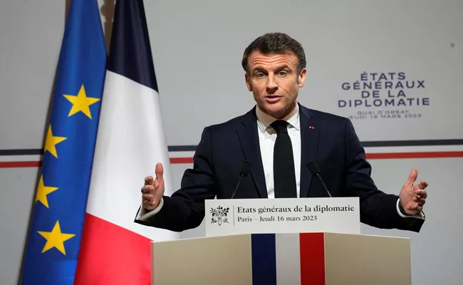 French President Macron overrides parliament to pass retirement age bill - Sakshi