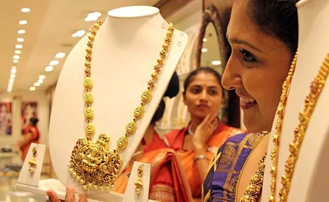 Gold prices volatality in India 24 carat gold drops and gains for ten grams - Sakshi