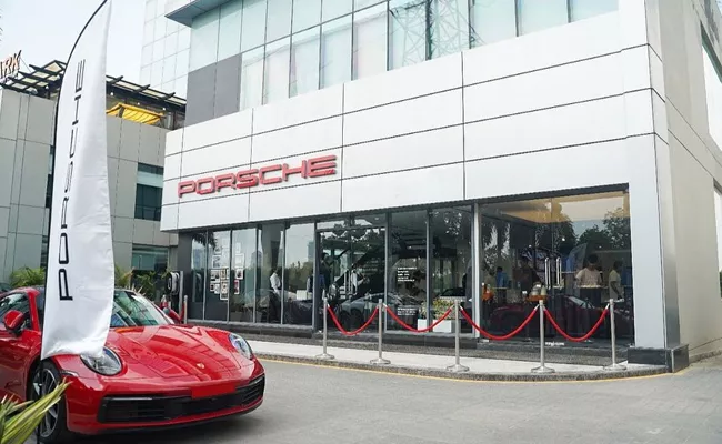 Consumer court asks porsche to pay customer rs 18 lakh fine for misrepresenting model year details - Sakshi