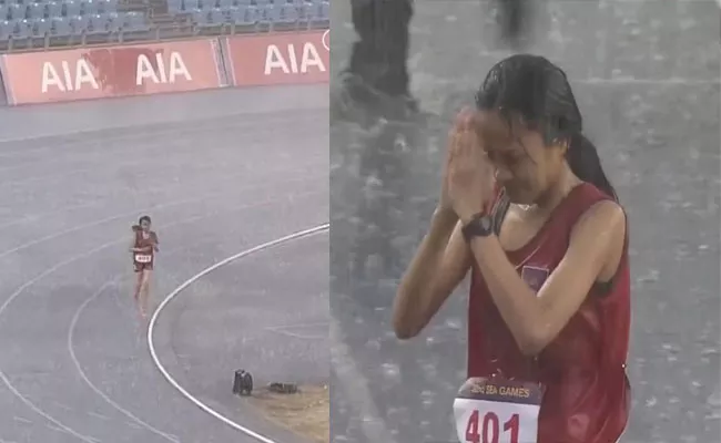 Cambodian Athlete Bou-Samnang Complete-5000m Race-Heavy Rain Wins-Hearts - Sakshi