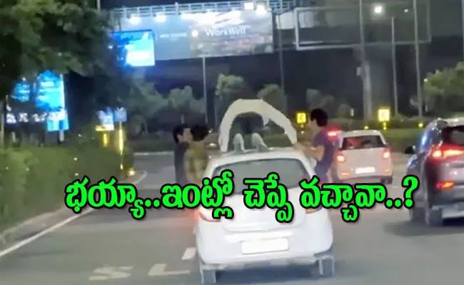 Gurugram Man Seen Doing Push-Ups On Top Of Moving Car Video Viral - Sakshi