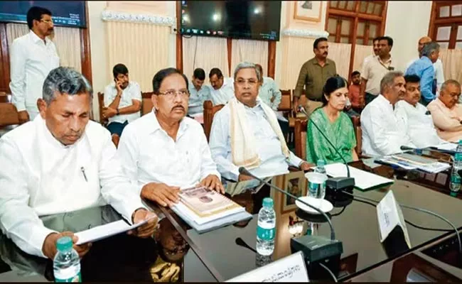 Karnataka CM Siddaramaiah Cabinet Approves Five Poll guarantees - Sakshi