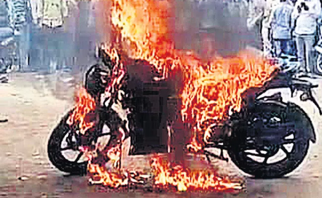  Young Man Burning Two Wheeler Vehicle TVS Showroom   - Sakshi