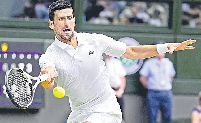 Novak Djokovic belatedly seals quarter final spot  - Sakshi