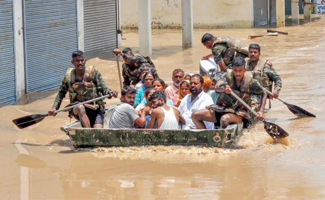 Alert in Prayagraj as Ganga Yamuna rivers swell Red Alert For Uttarakhand - Sakshi