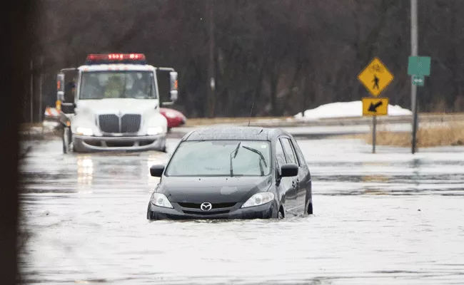 US: Heavy rains, flash flooding swamp Northeast - Sakshi