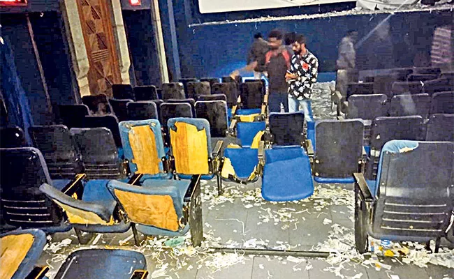 Case Registered Against Pawan Fans Who Destroyed Theater - Sakshi