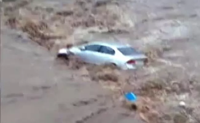 Flooded Gujarat City Cars Swept Away   - Sakshi