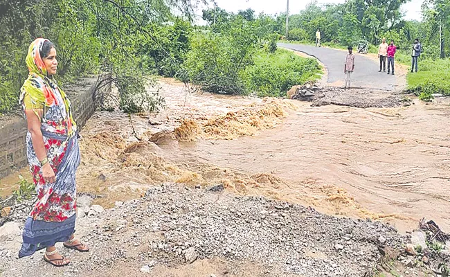 Mother and Son Waiting at flood - Sakshi