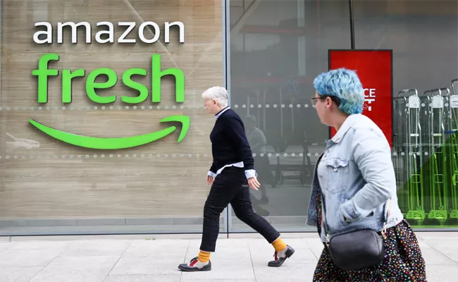 Amazon layoff hundreds employees in grocery stores - Sakshi