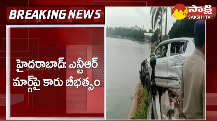 Car Hit Hussain Sagar Divider on Over Speed