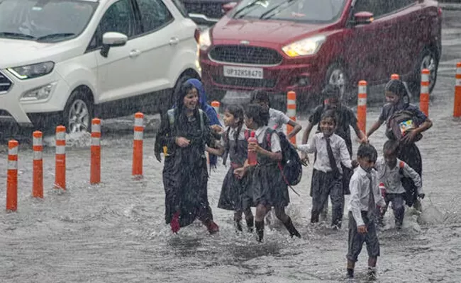 Heavy Rainfall In Delhi IMD Issues Yellow Alert - Sakshi