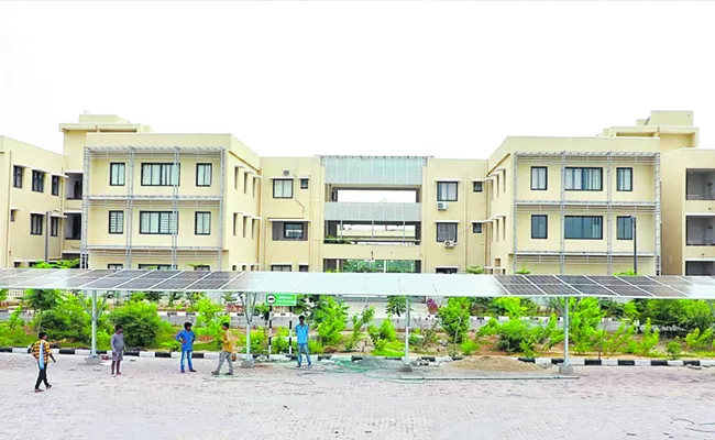 Solar roof parking shed at Khammam collectorate - Sakshi