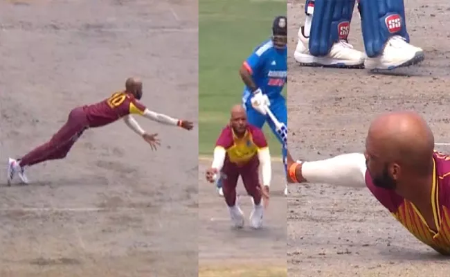 Roston Chases stunning diving catch ends Tilak Varma - Sakshi