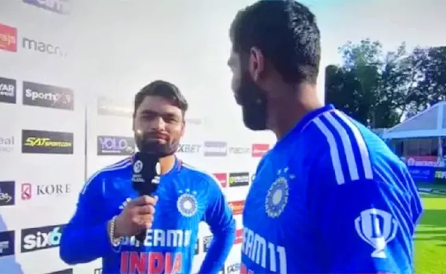 Bumrah turns translator for Rinku - Sakshi