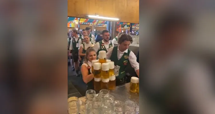 Woman Carries Impressive Amount Of Beer Glasses 