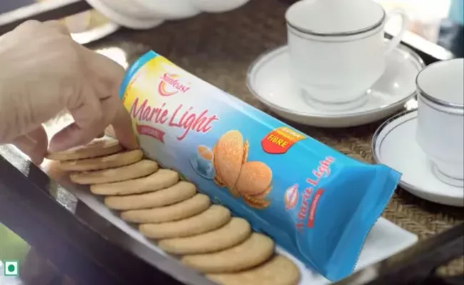 ITC Fined Rs 1 Lakh After Man Complains One Biscuit Missing In Sunfeast Marie Pack - Sakshi