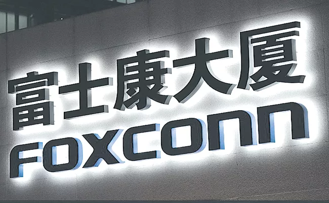 Foxconn planning to make EVs in India - Sakshi