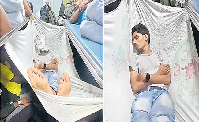 Man Caught Sleeping Peacefully In Makeshift Hammock On Crowded Train - Sakshi