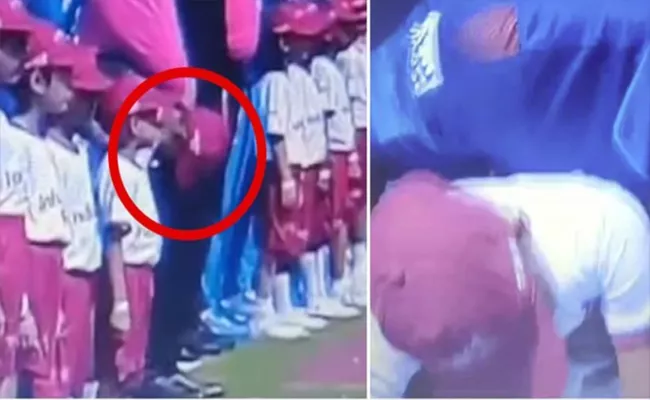 Kid faints during Afghanistan Sri Lanka national anthems - Sakshi