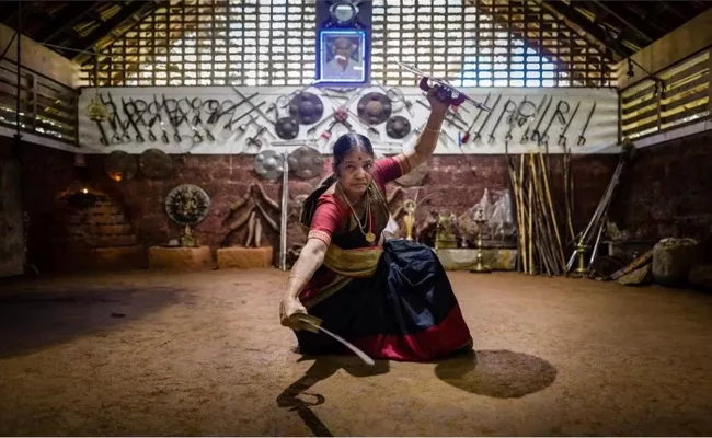 80 Year Old Meenakshi Gurukkal Gives Kalaripayattu Sword Lessons In A Saree  - Sakshi