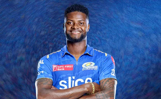 Star LSG player Romario Shepherd traded to Mumbai Indians ahead of IPL 2024 auction - Sakshi