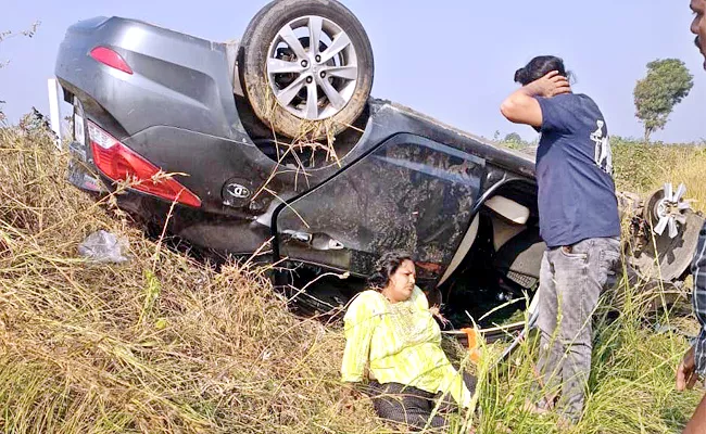 car overturned in road - Sakshi