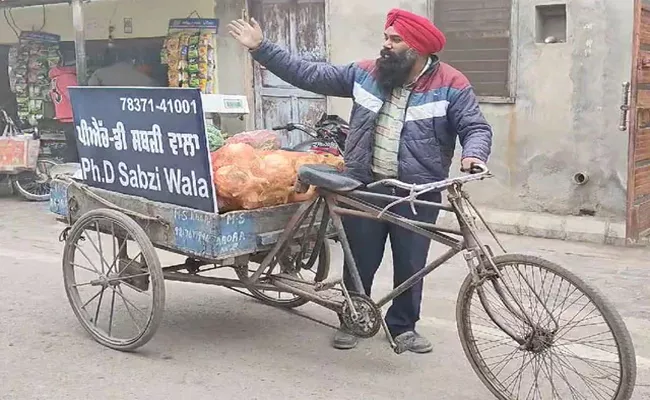 With PhD 4 Masters Degrees But  Punjab Man Sells Vegetables  - Sakshi