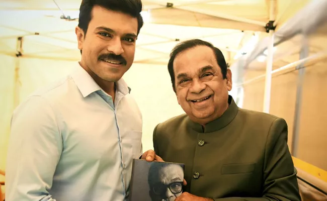 Ram Charan With Brahmanandam Nenu Book In Game Changer Shoot - Sakshi