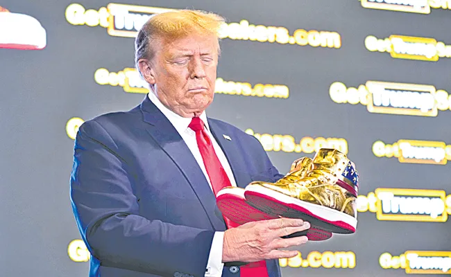 Donald Trump unveiled his line of gold sneakers at Sneaker Con in Philadelphia - Sakshi