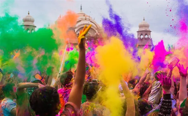 Celebrated Holi in Dubais Krishna Temple - Sakshi