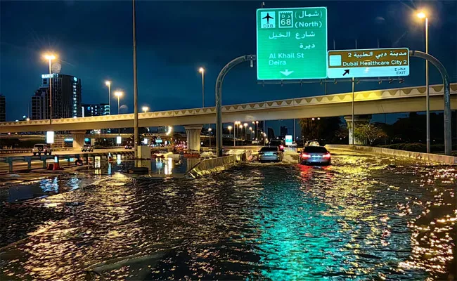 A years worth of rain plunges normally dry Dubai underwater - Sakshi