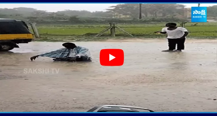 Men Drinking In Rain At Suryapet District