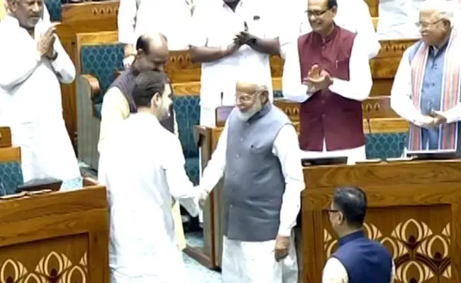 PM Modi Rahul Gandhi Shake Hands As They Welcome New Lok Sabha Speaker