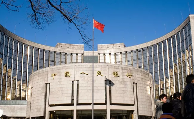 China reduced a key short term policy rate and benchmark lending rates