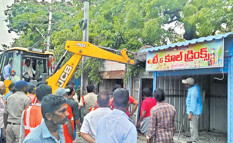 Demolition of shops and buddies with JCBs in Kanigiri