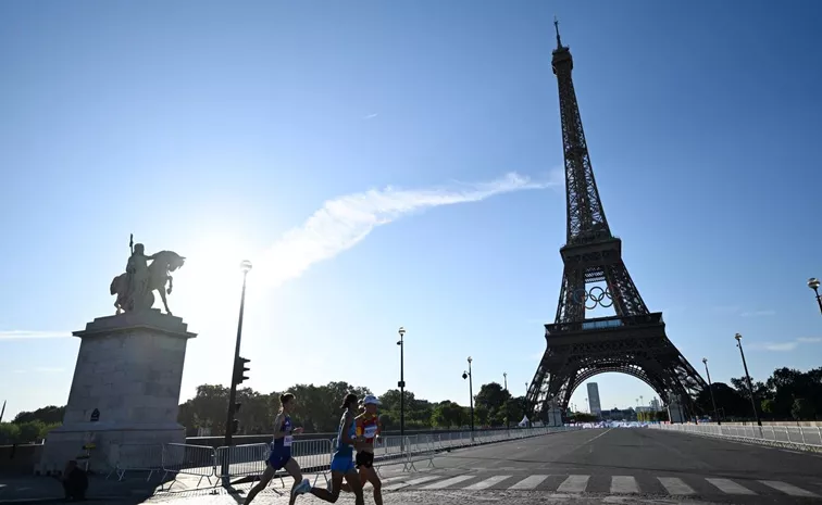 Paris 2024 Olympics: Man climbing Eiffel Tower