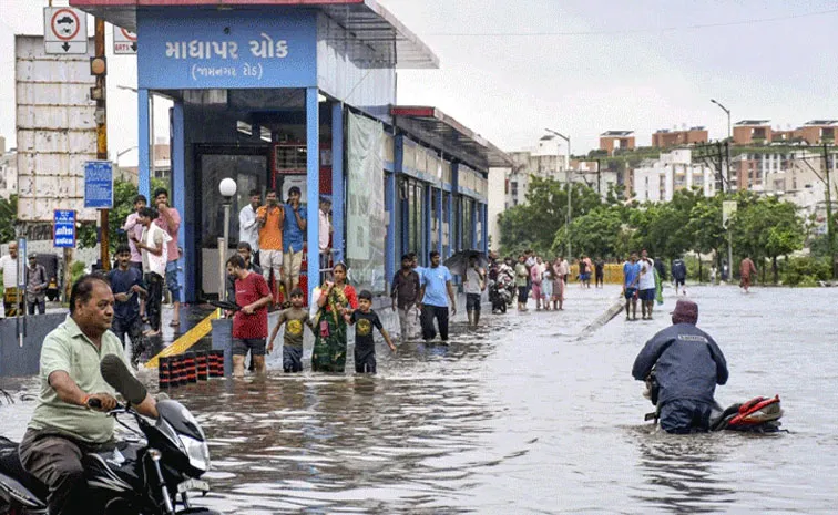 Gujarat sees massive flooding after heavy rain 15 dead 20000 evacuated