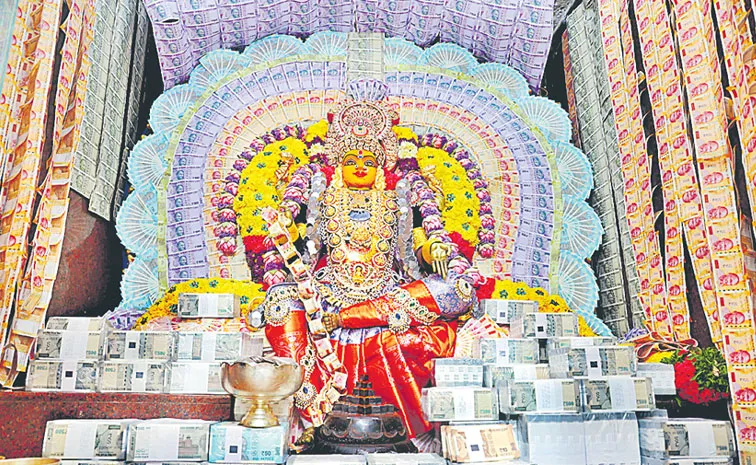 Goddess decorated with Rs 6 crores worth currency notes in Mahbubnagar 