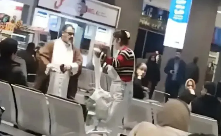 Iranian woman removes cleric turban in airport