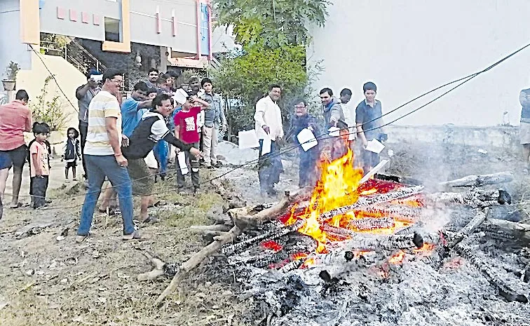 AP People burn power bills in Bhogi fire in protest against hike in tariff in AP