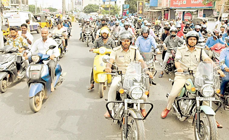 Nellore cops bike rally on Helmet safety Photo Feature