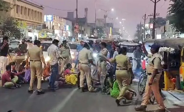 Woman protests in front of police station