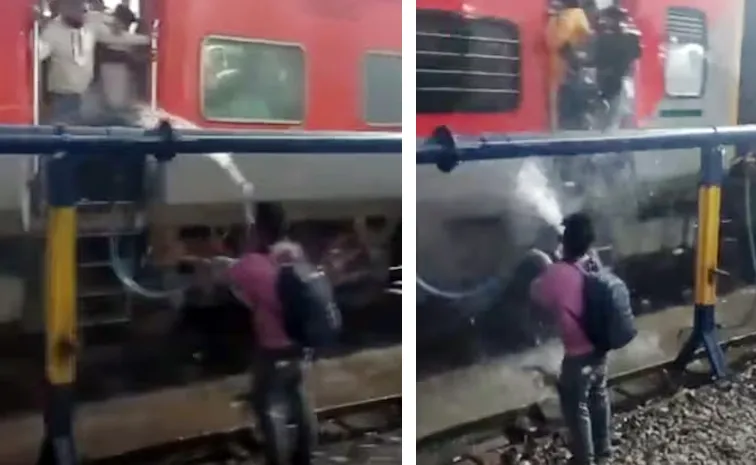 Man Sprays Water On Train Passengers Standing At Open Doors