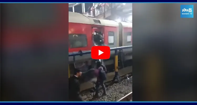 Man Sprays Water On Train Passengers Standing At Open Doors